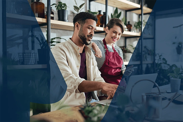 Small business owners working together on a laptop