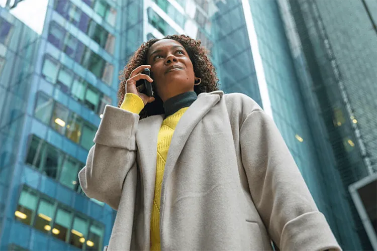 Business professional making a mobile call in a city
