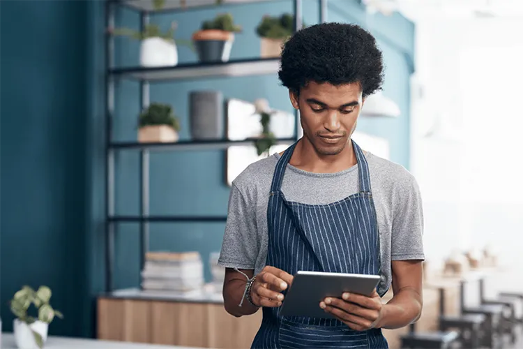 Small business owner using a tablet