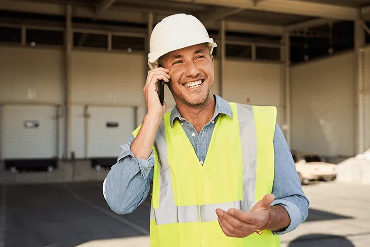 Construction worker making a mobile call