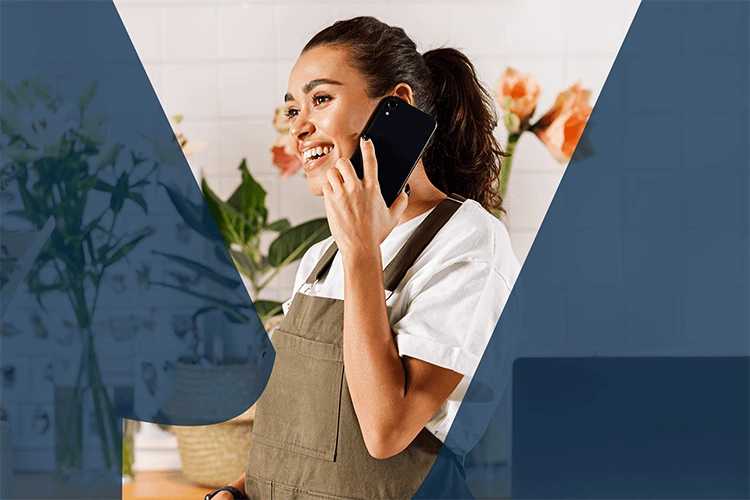 Small business owner making a call on a mobile phone