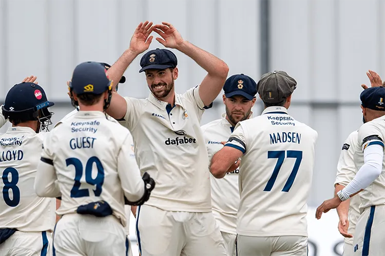 Derbyshire County Cricket Club players celebrating during a match