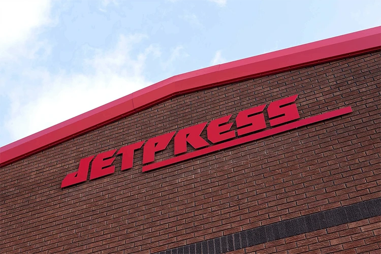 Image of Jet Press signage on the side of a building