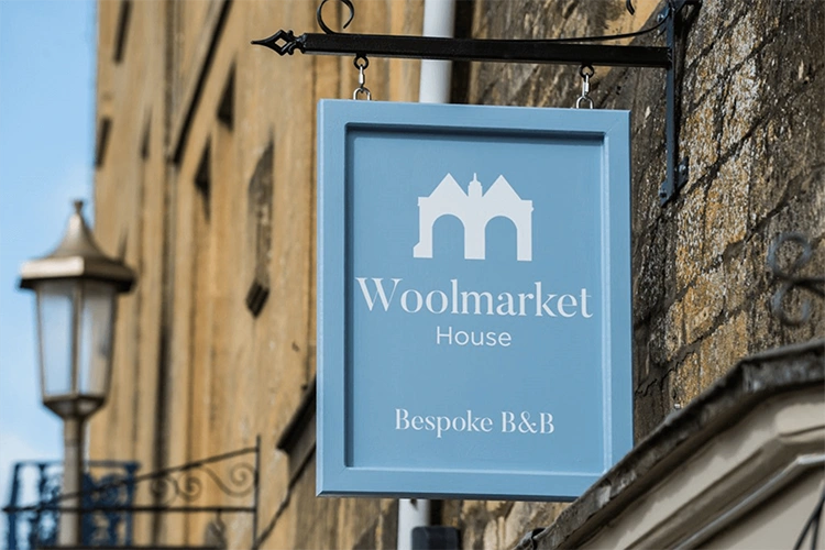 Close-up view of Woolmarket House exterior signage